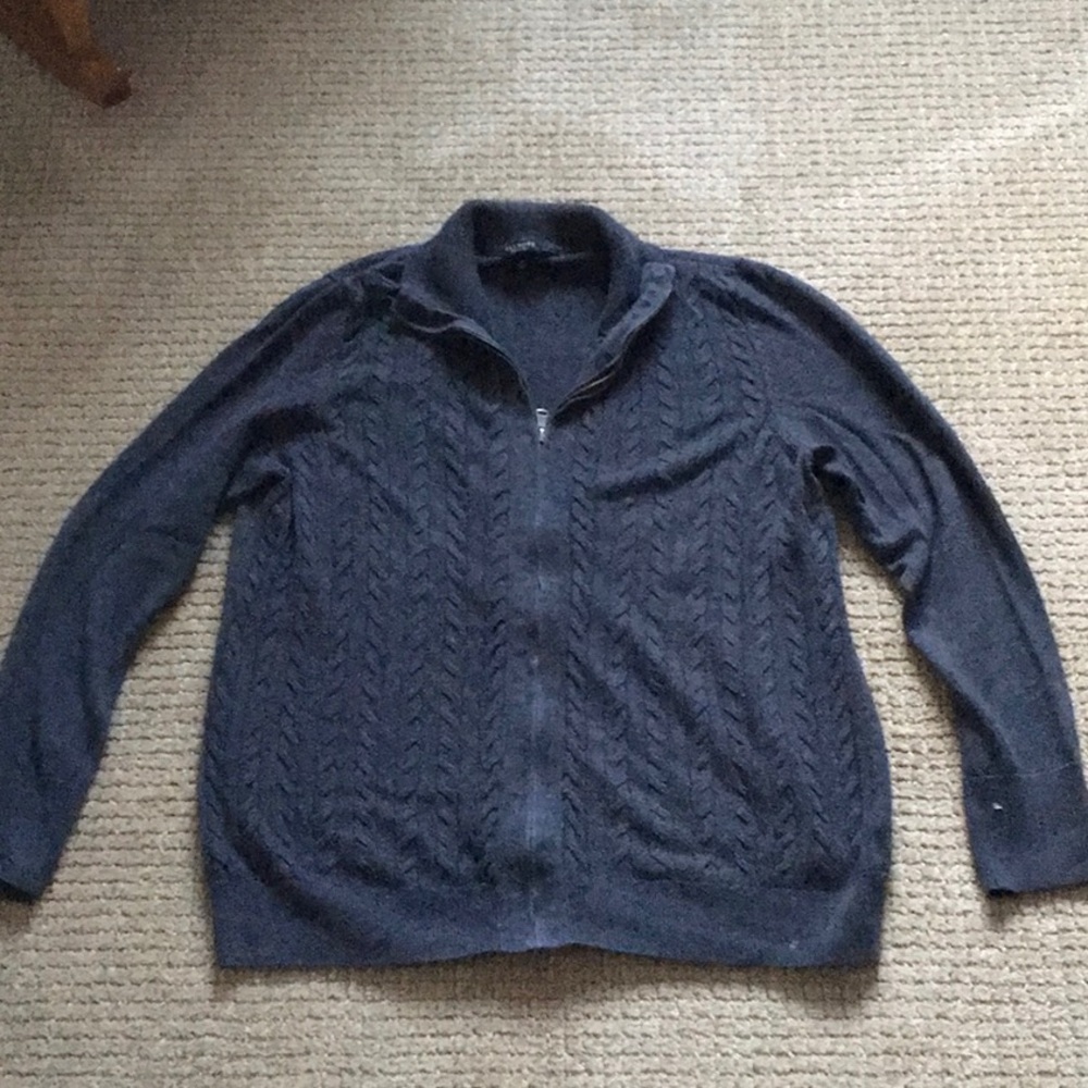Cable knit sweater with full zipper front. 55/35/10 cotton, poly, wool blend.
